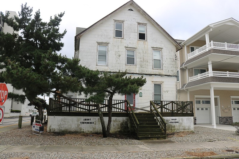 The house is deteriorated now, its white paint badly faded.