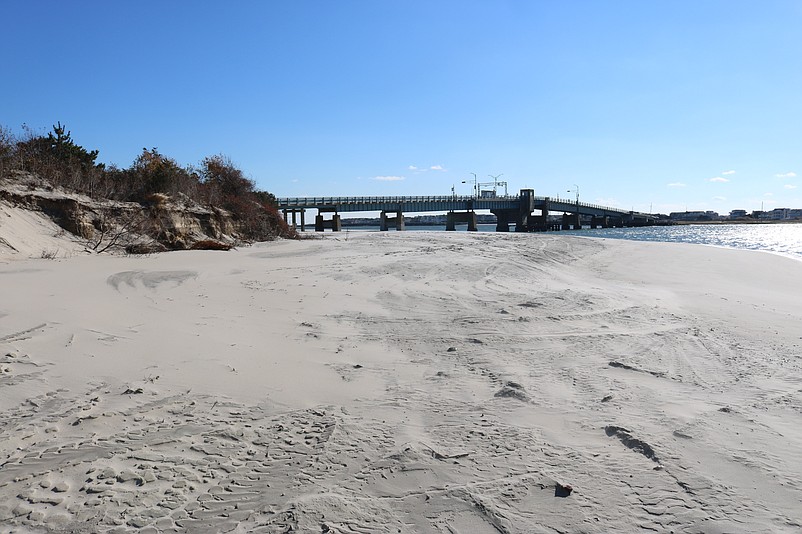 The wider beach stretches all the way along the bay side of the Townsends Inlet Bridge.