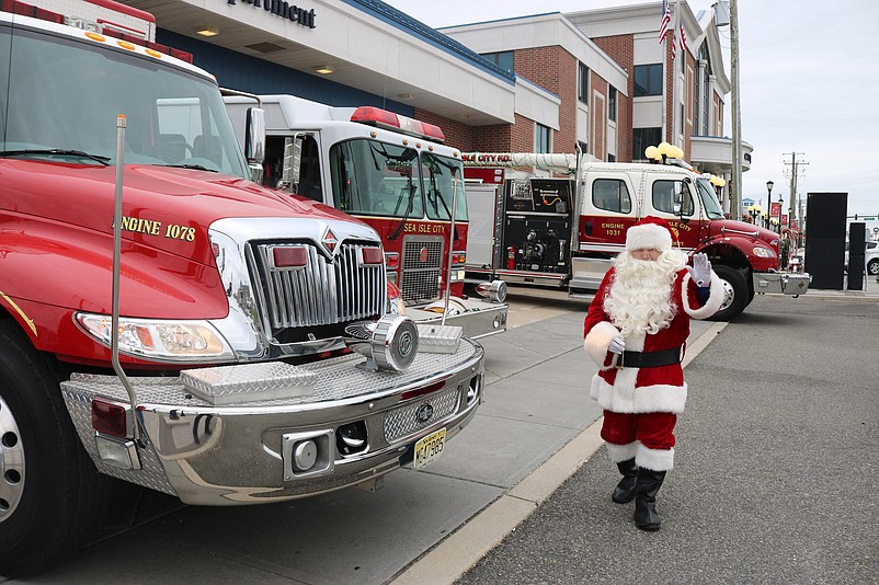 Santa gets ready for the parade during an appearance at Sea Isle's fire department.