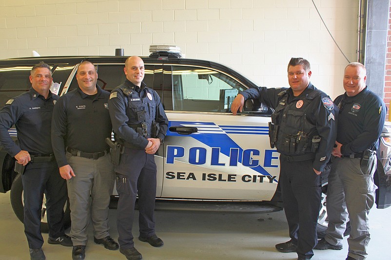 Some of the officers show off their clean-shaven faces just before the fundraiser began.