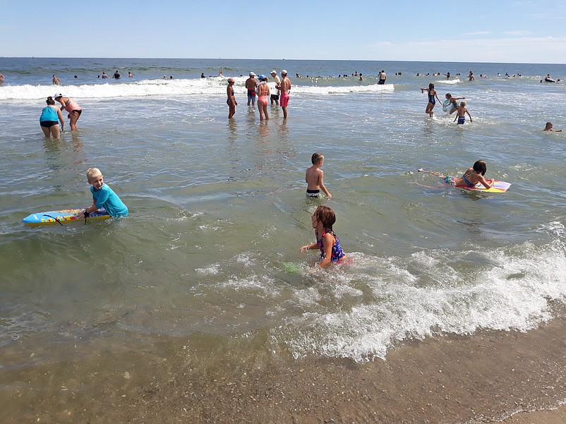 Lifeguards keep watch over bathers in what is starting off as an active-weather summer.