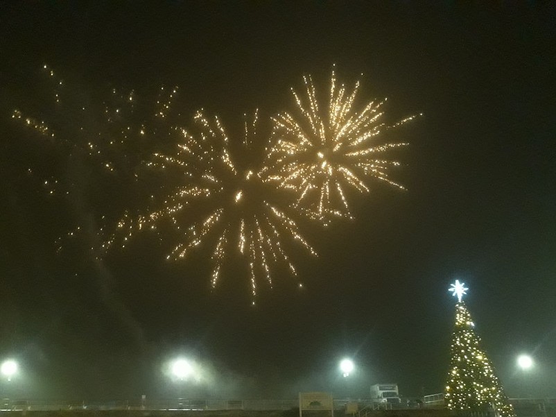 Fireworks explode in the misty New Year's Eve sky above Sea Isle City.