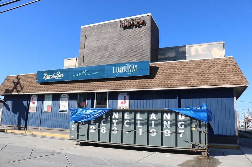 The three-story Ludlam Hotel, shown in the background, will undergo a renovation and expansion to turn it into resort-style lodging.