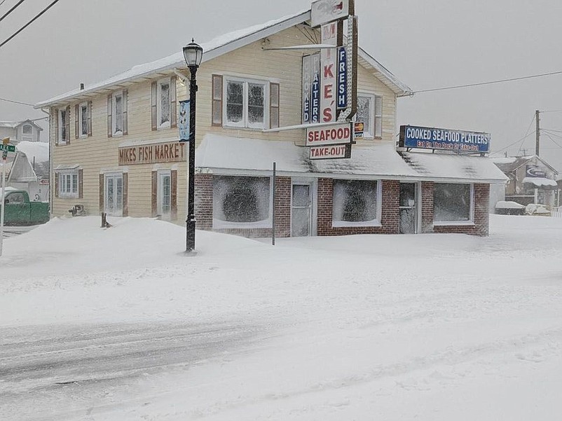 Heavy snow piles up in front of Mike's Seafood on Park Road during the Jan. 28-29 blizzard. (Courtesy of Mike's Seafood Facebook page)