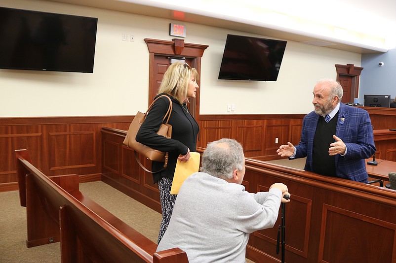 Mayor Leonard Desiderio speaks with Bill and Terri Carapucci after the City Council meeting.