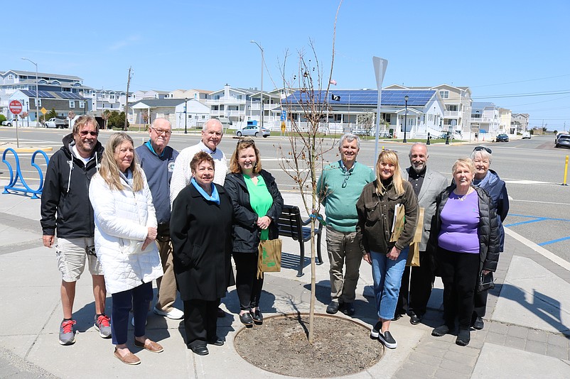 Sea Isle City officials and volunteers celebrate Arbor Day in 2022 with a group photo next to a newly planted crepe myrtle tree.