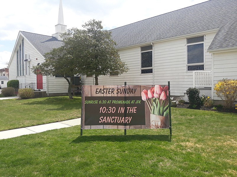 A sign outside the United Methodist Church announces the sunrise service held Easter morning on the Promenade.