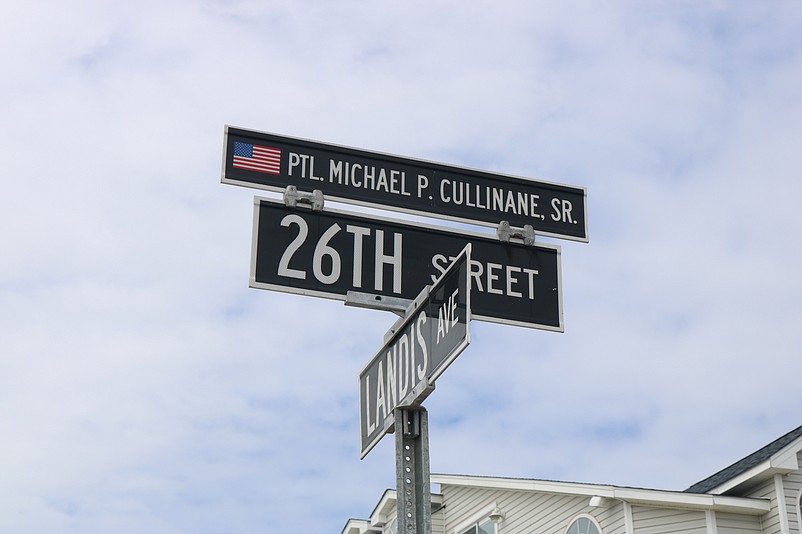 The sign atop 26th Street honors the late officer.