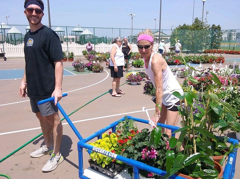 Nick DiNote and his mother, Patti DiNote, of Sea Isle, fill up their wagon with an array of plants. 