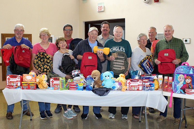 The Knights of Columbus Madonna Maria Council 3560, of Saint Joseph Church, fills items collected into backpacks to be shipped to Eastern Europe. (Photo courtesy of Sea Isle City)