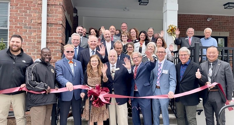 Elected officials, Sturdy Savings Bank board members and employees hold a ribbon-cutting ceremony. (Photo courtesy of Suasion Communications)