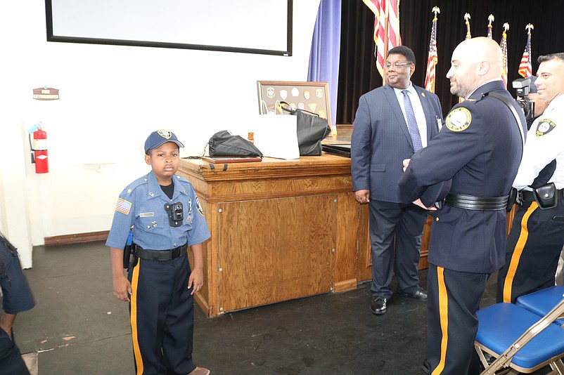 D.J. looks at the officers shortly after his entrance into the Music Pier.