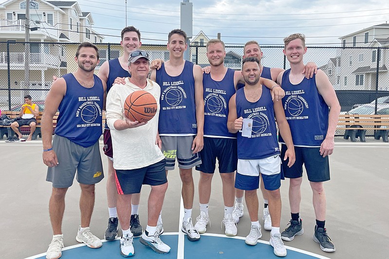 Tournament namesake Bill Liddell, holding basketball, joins the winners, Team Speed. (Photo courtesy of Sea Isle City)