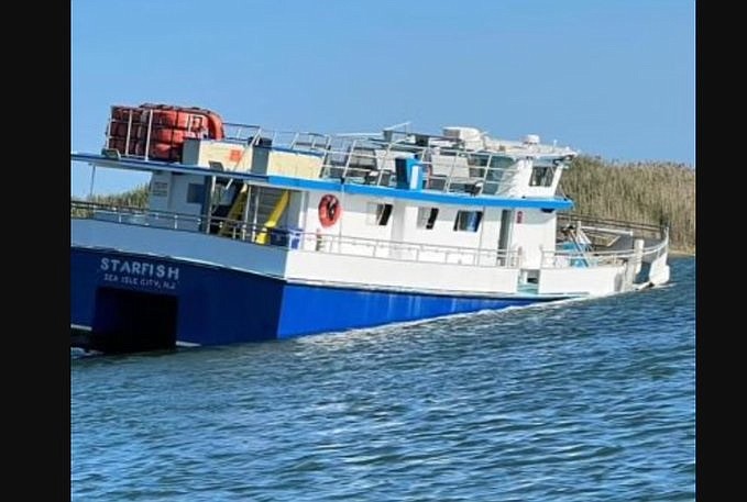 The Starfish charter boat takes on water in a channel in Sea Isle. (Photo courtesy of James Santore on Facebook)