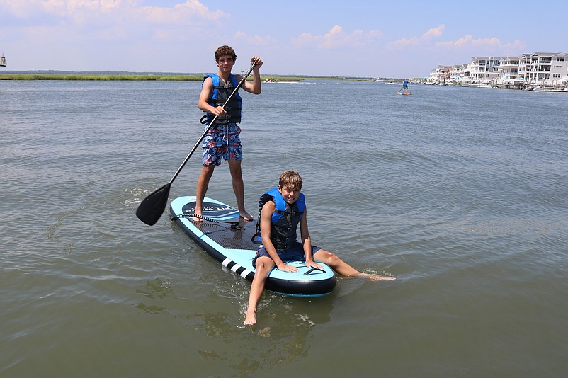 Brothers Mike and Ryan Noone paddle around the back bay.