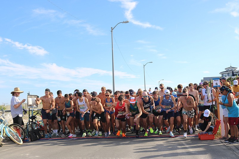 Runners get underway at the starting line for the Captain Bill Gallagher 10 Mile Island Run in 2022