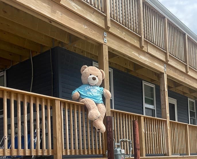 The oversized teddy bear sits on the deck railing at 3820 Central Ave. before he disappeared. (Photos courtesy of Jonathan Markulics)