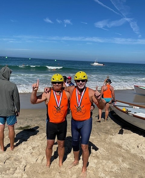 Wayne Mac Murray, left, and Mark Myhre celebrate their national rowing championship in Hermosa Beach Calif., while wearing their gold medals. (Photos courtesy of Mark Myhre and Wayne Mac Murray)