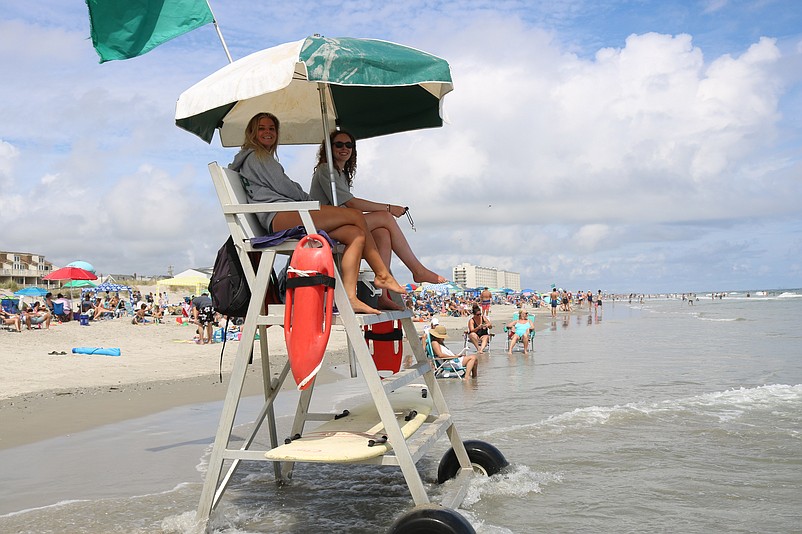 Lifeguards Hailey Mills and Maddie Farley protect the swimmers at the 45th Street beach. 