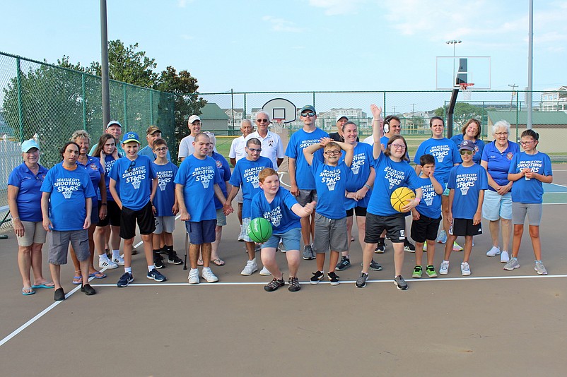 Players in Sea Isle’s Shooting Stars basketball clinic, in foreground, are shown with supporters from VFW Post 1963. (Photo courtesy of Sea Isle City)