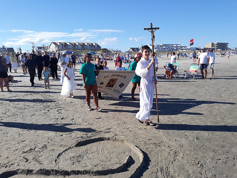 The Wedding of the Sea procession unfolds on the beach during the 2022 celebration.