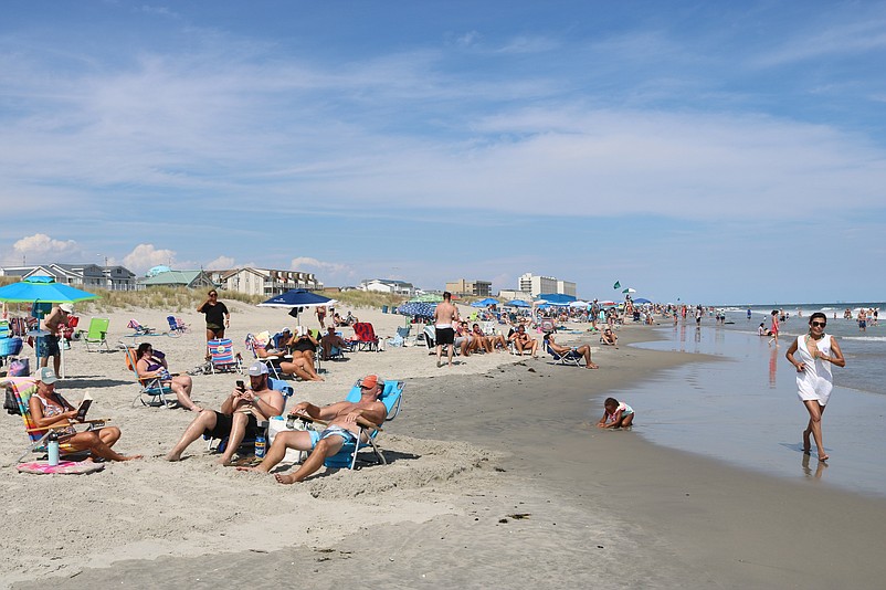 Beachgoers savor the last few hours of their Labor Day weekend.