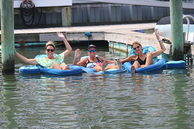 From left, Megan Santoro, Terri Moore and Sharon Kessler spent some relaxing time while floating in the lagoon at 43rd Place.