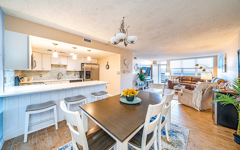 The condo boasts an open floor plan with patio bay views in Ocean City.