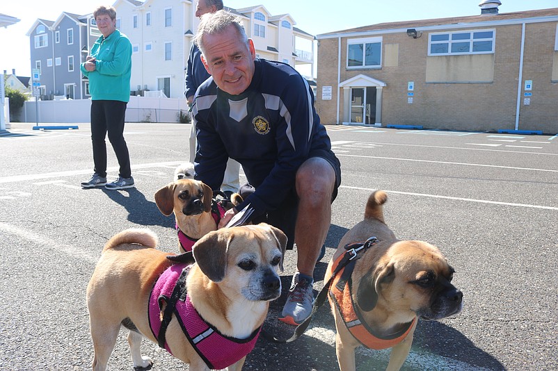 Tim McGrail, who lives in Sea Isle and Clearwater, Fla., is joined by his dogs, Scamp, Samantha and Sadie.