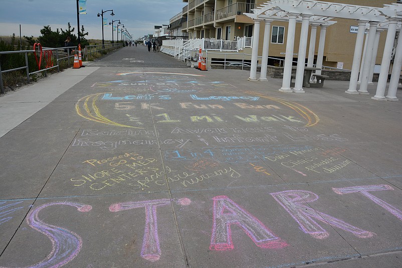 A mural of chalk art marks the starting line. 