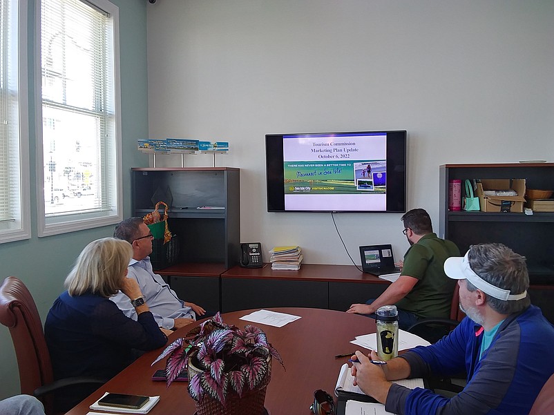 The Tourism Commission members listen to the presentation Thursday.