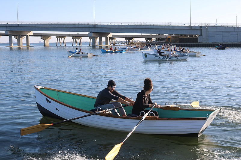 Jon O’Neil and Mia Grylicki join other rowers at the start of the Pilgrim Paddle regatta on the Great Egg Harbor Bay.