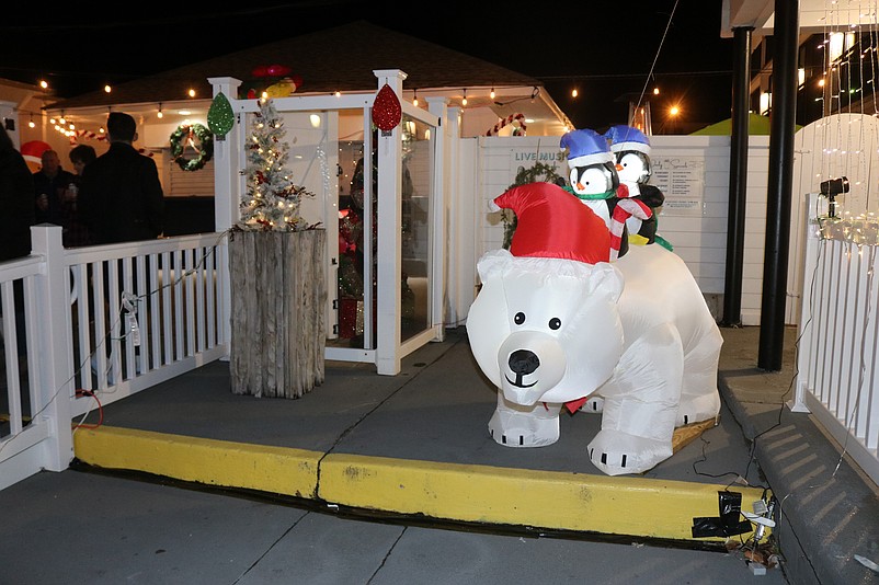 A polar bear with a Santa cap is part of the festive decor.