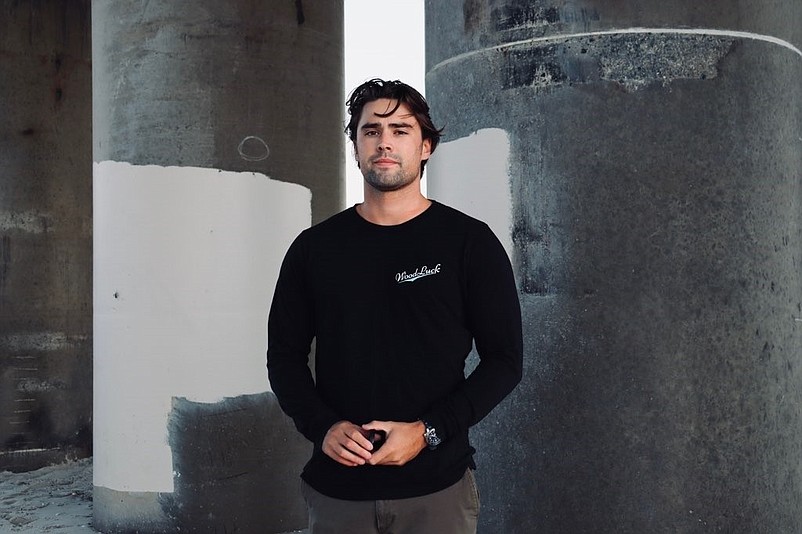 Ocean City resident Jake Brown wears one of his designs, a classic long-sleeved WoodLuck tee. (Photos courtesy of Jake Brown)