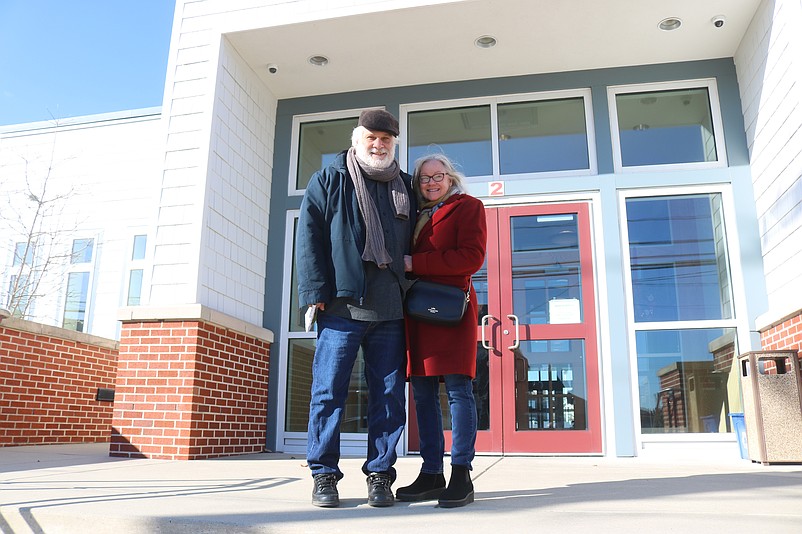 Tom Buono Jr., and his wife, Kathleen, stand on the steps of St. Joseph Catholic Church after observing Christmas Mass.