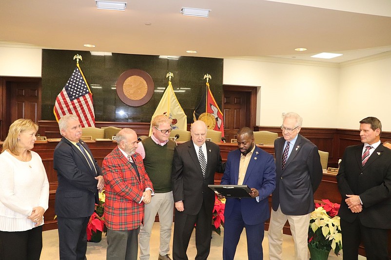 Flanked by other elected officials, state Assemblyman Antwan McClellan, of Ocean City, presents a proclamation to Commission Director Gerald M. Thornton recognizing his government service. (Photos courtesy of Cape May County)