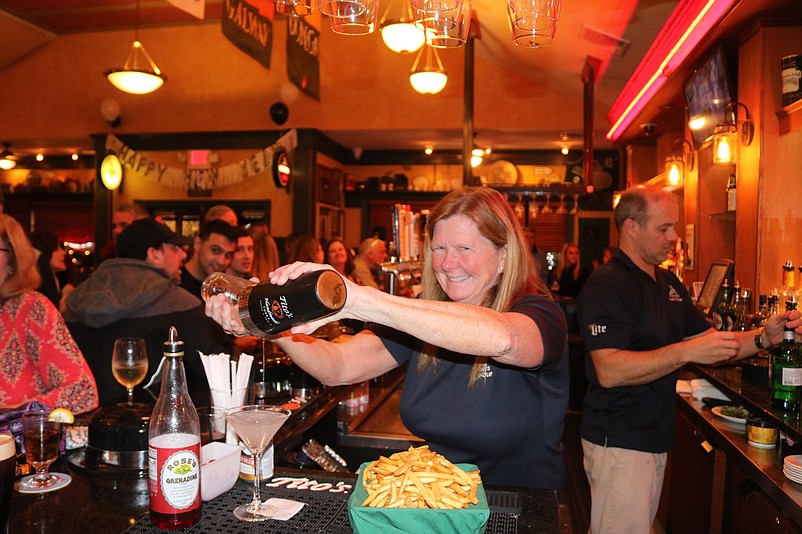 Kathy Larkin mixes a cocktail at O'Donnell's Pour House.