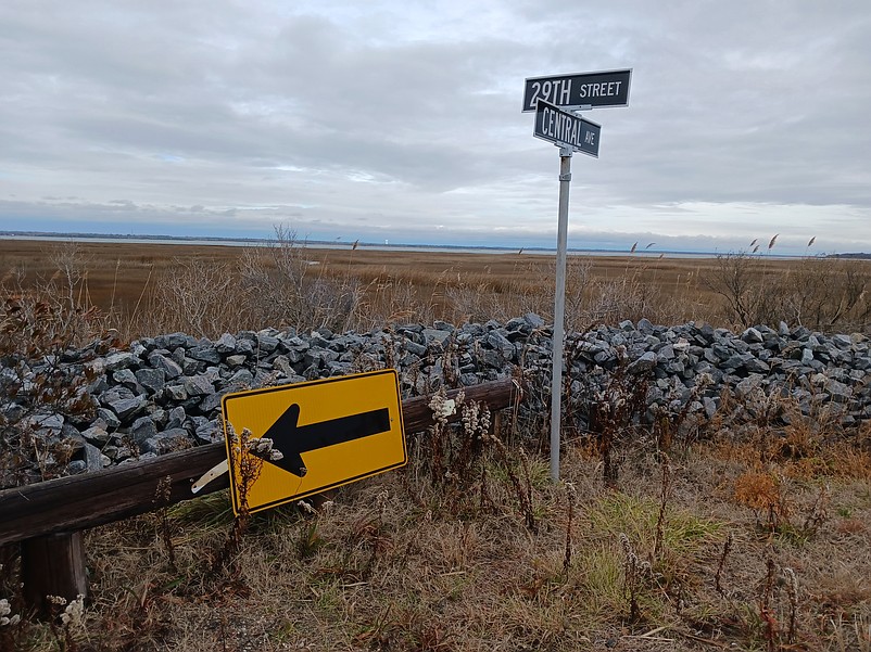 A rock wall that overlooks the marshlands at 29th Street and Central Avenue serves as a barrier against floodwater.