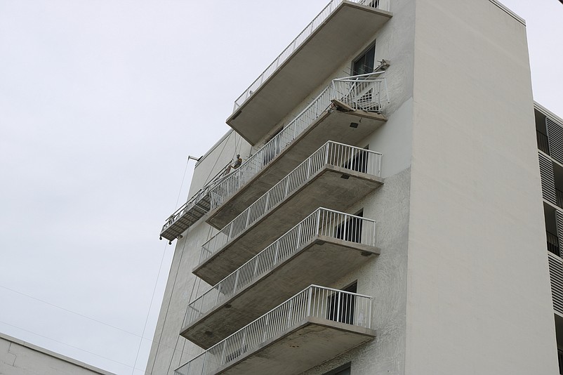 This photo shows how a balcony on the eighth floor collapsed onto the balcony directly below at the south tower of the Spinnaker condominiums.