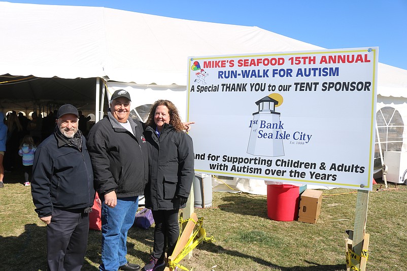 The event's organizers, husband and wife Mike and Jeannie Monichetti, are joined by Sea Isle Mayor Leonard Desiderio at the Mike's Seafood Run-Walk For Autism on Feb. 18, 2023.