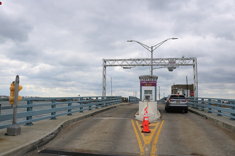 Traffic passes through the toll plaza on the Townsends Inlet Bridge.