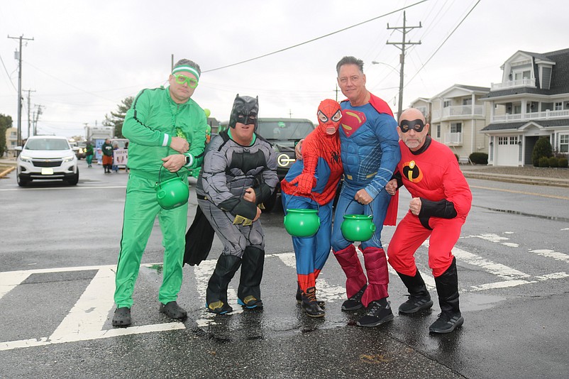 Six superheroes strike a pose.