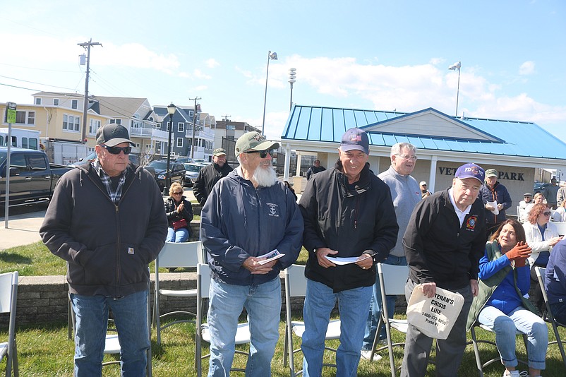 Some of the veterans stand during the ceremony to be applauded by the crowd.