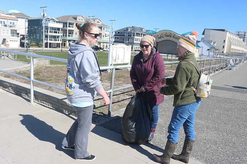 Amy Ward, Carolyn Beck and Marissa Ward talk about the litter they removed from the beach and dunes.