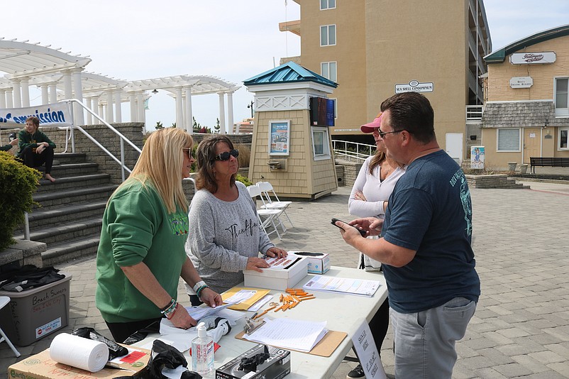 Volunteers for the cleanup sign up at one of the Environmental Commission tables.