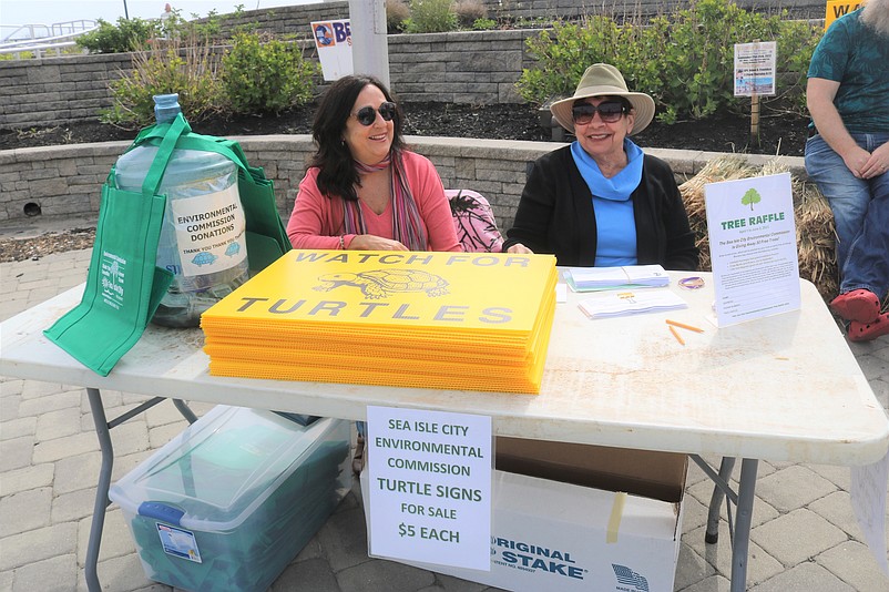 Sea Isle City Environmental Commission Chairwoman Annette Lombardo, right, and Environmental Commission member Maria Andrews display some of the "Watch for Turtles" lawn signs.