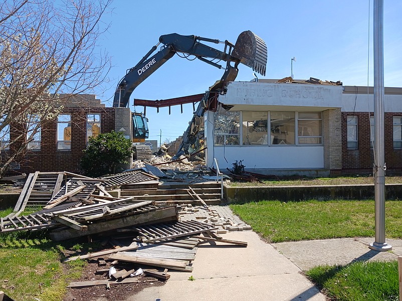 An excavator demolishes the old public school in April 2023 to make room for construction of Sea Isle's new community recreation center.