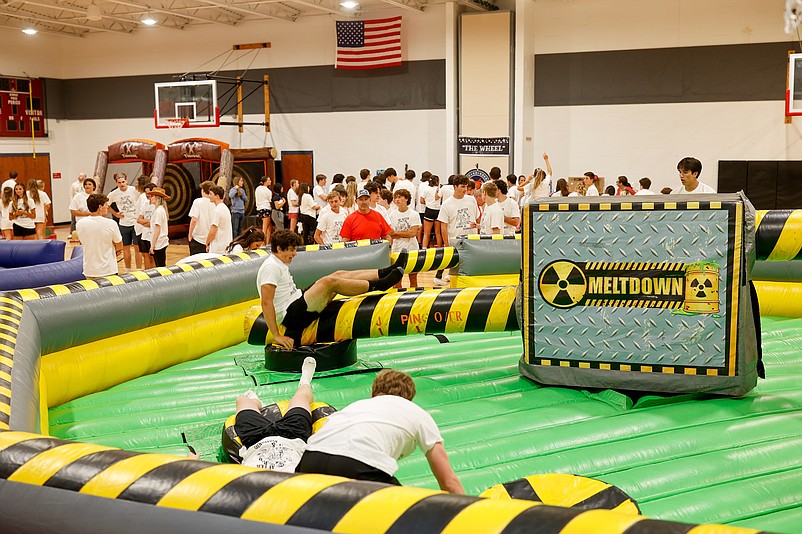 Prom-goers enjoy inflatable games.