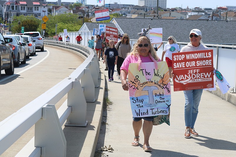 Wind farm opponents march across the Ninth Street Bridge in Ocean City during a protest in May.