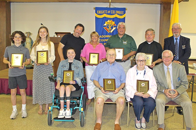 The honorees hold their plaques during the Knights of Columbus awards ceremony. (Courtesy of Sea Isle City)